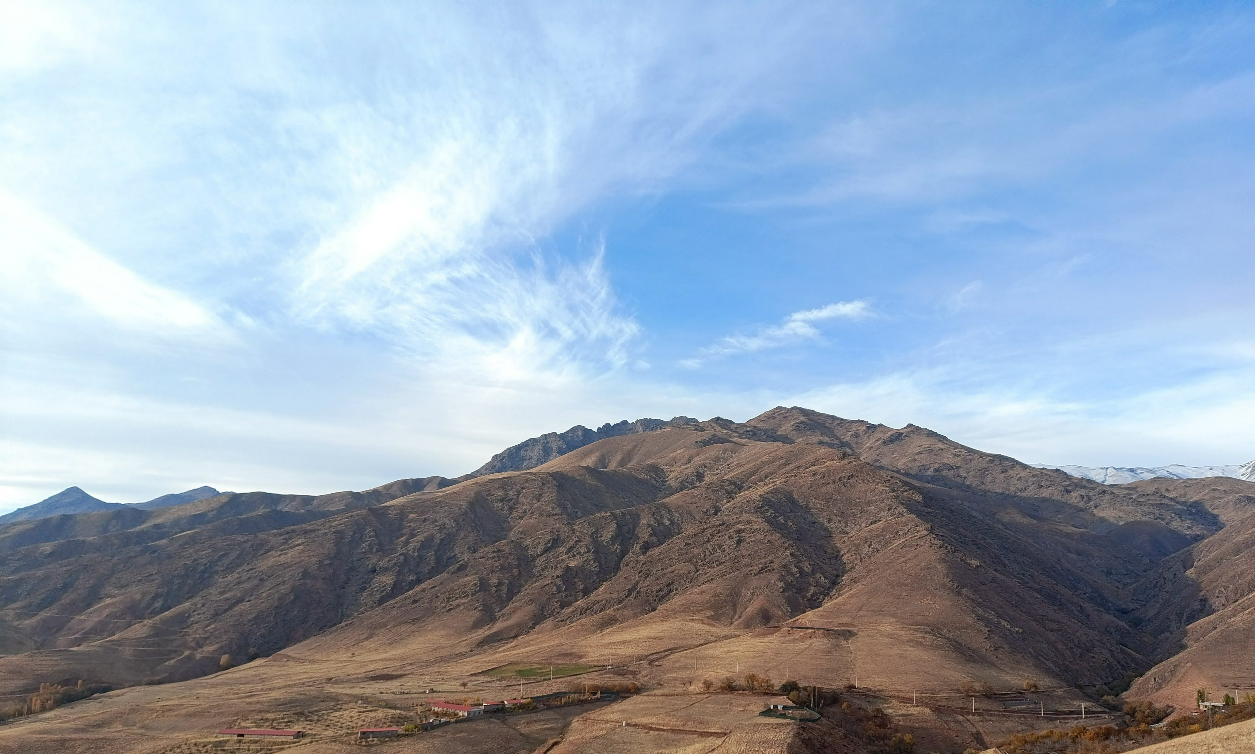Rugged high mountain peaks under blue sky